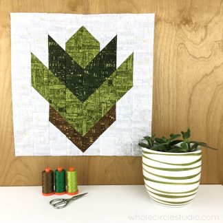 Leaf Peepers Quilt Pattern: Block 1. A modern, graphic spin on the traditional half square triangle. A great PDF pattern to use with solid fabric, prints or batiks! Pattern available at wholecirclestudio.com