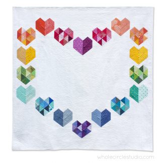 rainbow, scrap version of Love at First Sight — an easy, beginner-friendly foundation paper piecing quilt pattern and makes the perfect wedding, engagement, anniversary or friendship gift. It's also super sweet for a baby or kid. Included in the pattern are instructions for two types of heart blocks—basic and details along with fabric requirements and instructions to arrange the blocks into 3 layouts—a wall quilt or two types of throw quilts. Make it your own by swapping out fabric or rearranging the blocks.