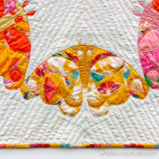 Close up of quilt that looks like a moth.