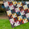 detail of graphic quilt with arrows arranged diagonally