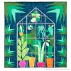 quilt of plants inside a greenhouse on a dark background