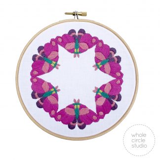 6 moths in a circle embroidered inside a hoop