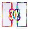 quilt with two colorful knots interlocking on a white background