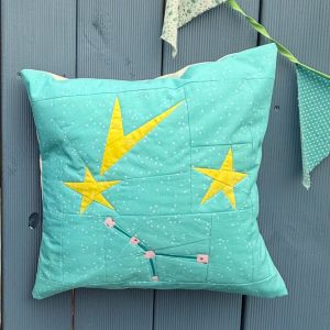 quilted pillow with star and constellation quilt blocks