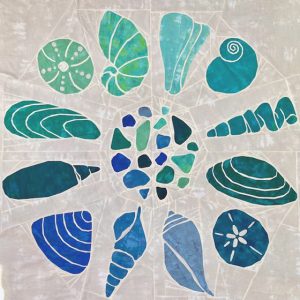 Turquoise and blue seashell quilt made with the Shoreline Shells quilt pattern.
