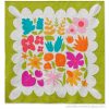 Colorful Wildflower Remix quilt showing large floral quilt blocks