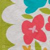 Close up of bright, foundation paper pieced flower quilt.