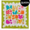 Colorful Wildflower Remix Queen quilt showing large floral quilt blocks