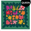 Colorful Wildflower Remix Queen quilt showing large floral quilt blocks on a forest green background with a bright green curvy border