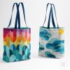 two modern quilted totebags with a colorful sunset and a cloud and sun scene
