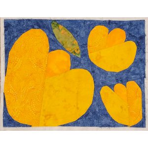 modern flower quilt block made with bright yellow and blue fabrics