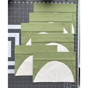 curve quilt blocks on a cutting mat
