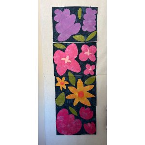 row of colorful flower quilt blocks on a navy blue background