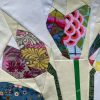 detail of Modern tulip quilt made with floral fabric scraps