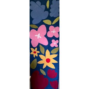 row of colorful flower quilt blocks on a navy background