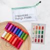 15 colorful spools of thread on a wooden plate, pouch that says Important Things Inside, and thread booklet